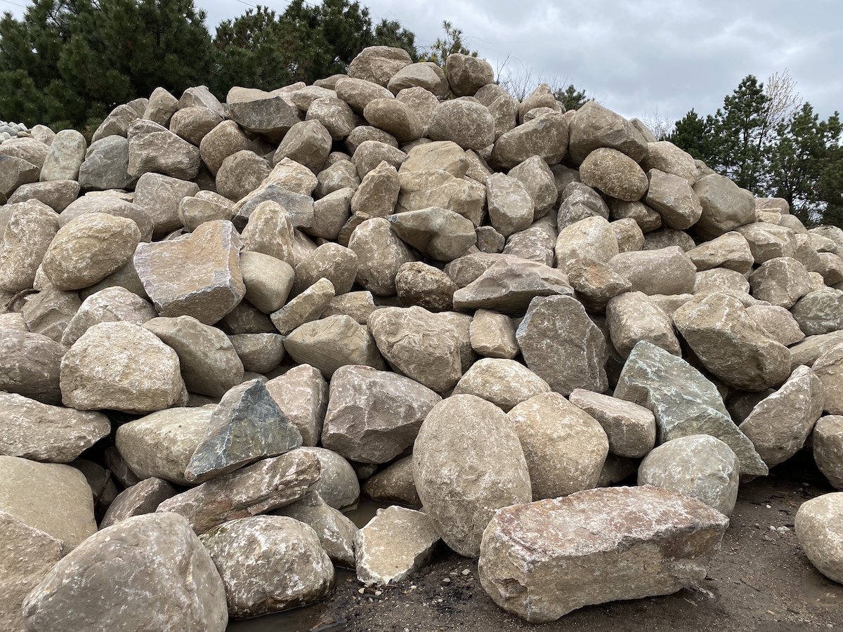 Boulders — Hand-picked accent boulders and outcropping stone, one-man up to crane-set.
